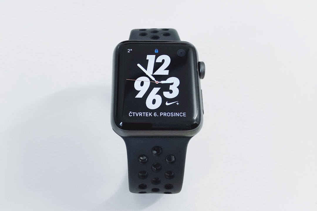 Samsung Galaxy Watch displaying fitness metrics on modern workspace