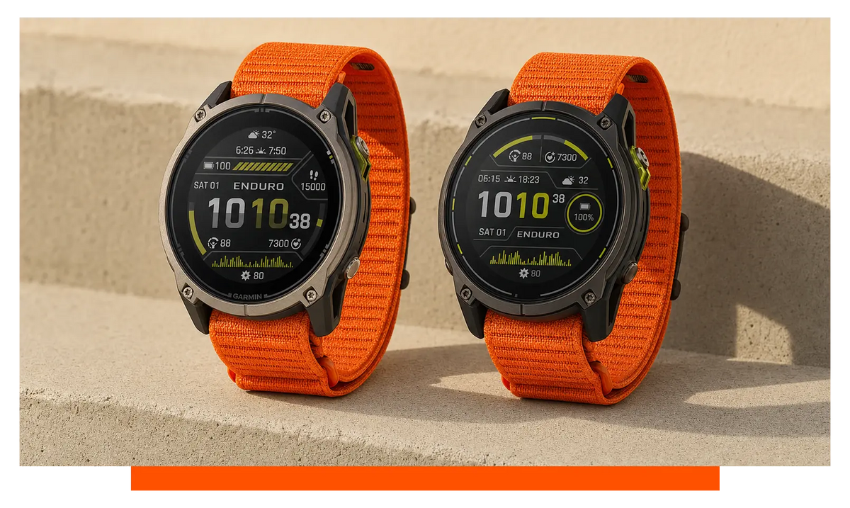 Two smartwatches shown side by side, on a concrete ledge - Garmin Enduro 4 and Garmin Enduro 3