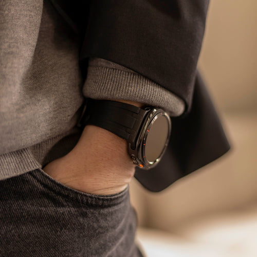 Bandz Samsung Galaxy Watch Ultra 2 siliconen band 'Luxe Liquid' (oranje met zwart)