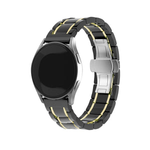 Metal Ceramic Link Strap, black/gold, on a watch, 3/4 front view